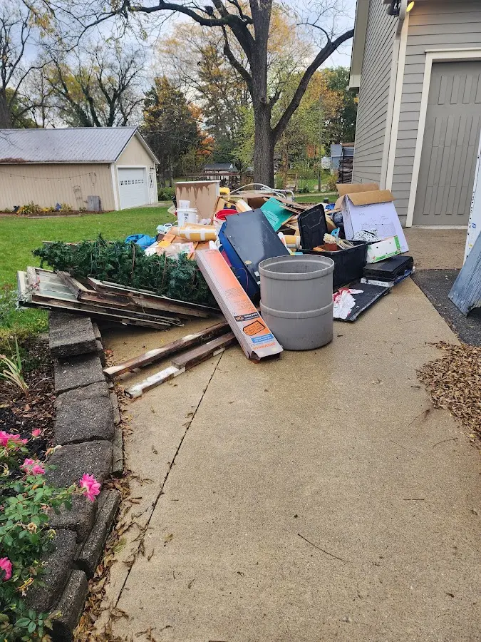 Dumpster being loaded with debris for Commercial Dumpster Rental in Lake View